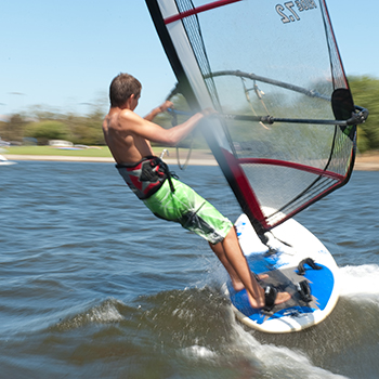 Person windsurfing really fast.
