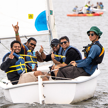 An instructor in a boat filled with students