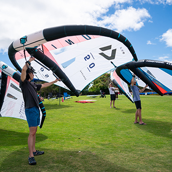 A group of studetns with the sails of wingfoils