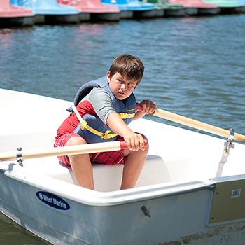 A boy in a row boat.